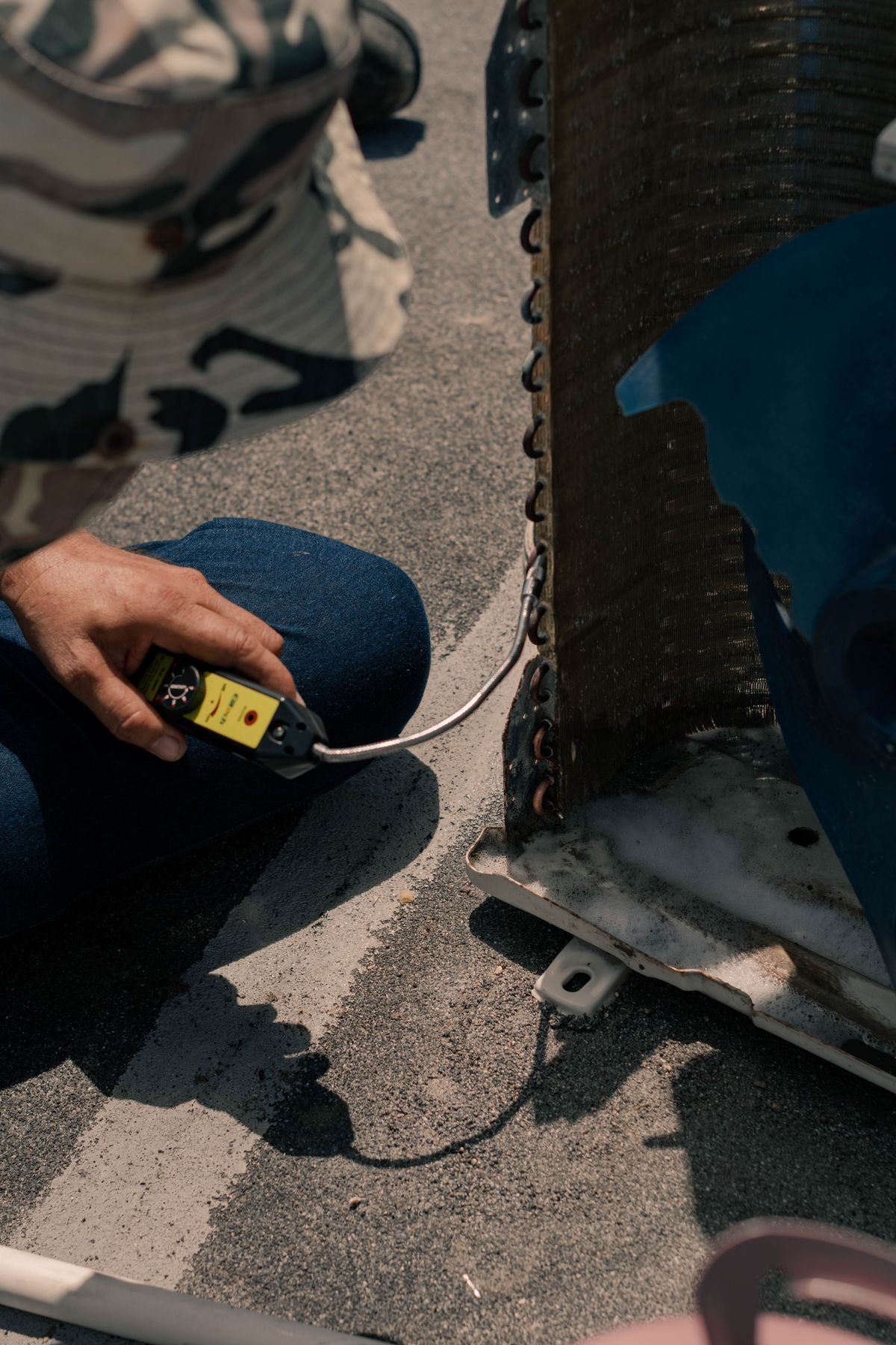 Close-up of air conditioner service work with hand tools